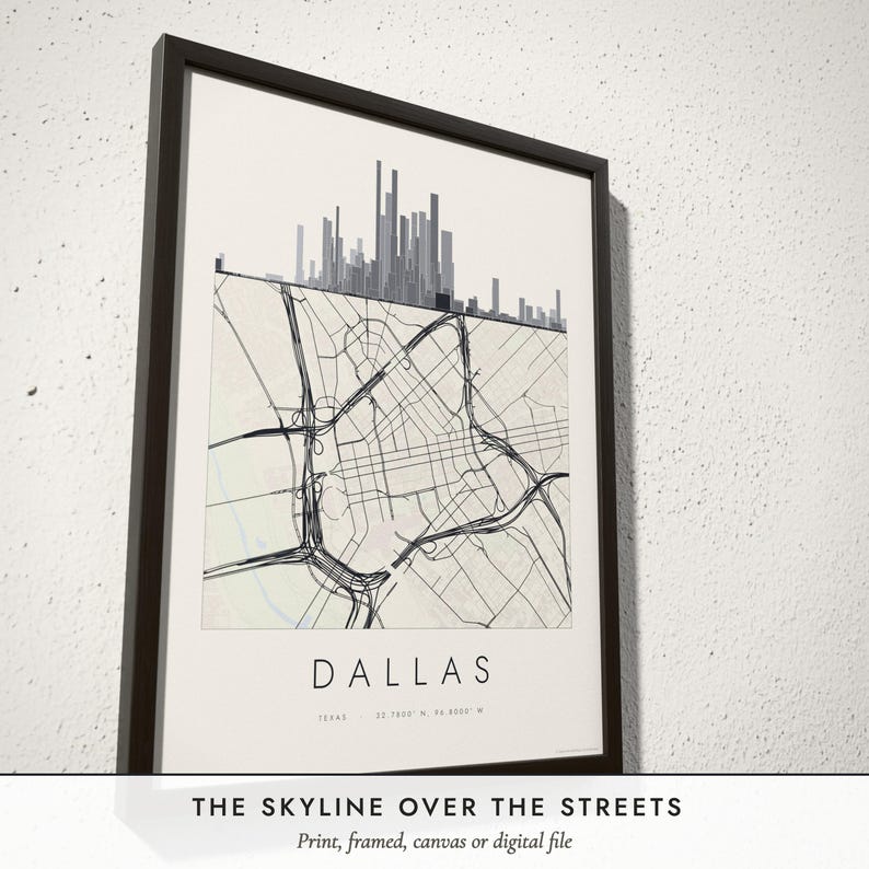 Three-quarter view of the framed Skyline & Street Map poster on a white plaster wall