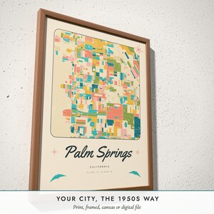 Three-quarter view of the framed Mid-Century City Map poster on a white plaster wall