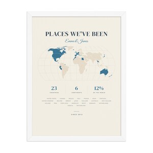 Real product photo: the Custom Places We've Been Map Print in the white wood frame with a clear acrylic front