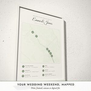 Three-quarter view of the framed Wedding Weekend Map poster on a white plaster wall