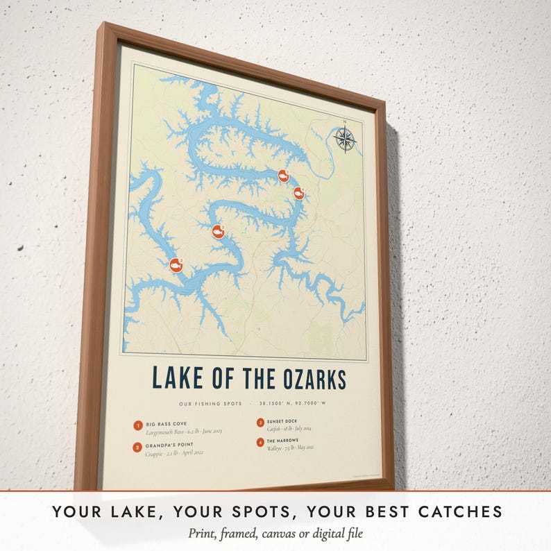 Three-quarter view of the framed Fishing Lake Map poster on a white plaster wall