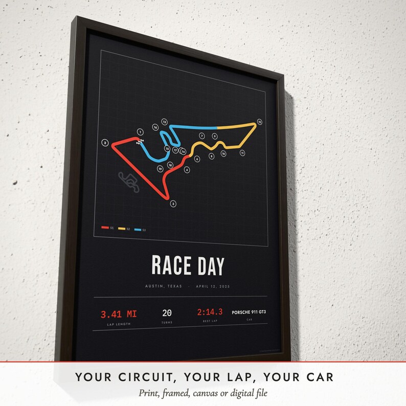 Three-quarter view of the framed Race Track Map poster on a white plaster wall