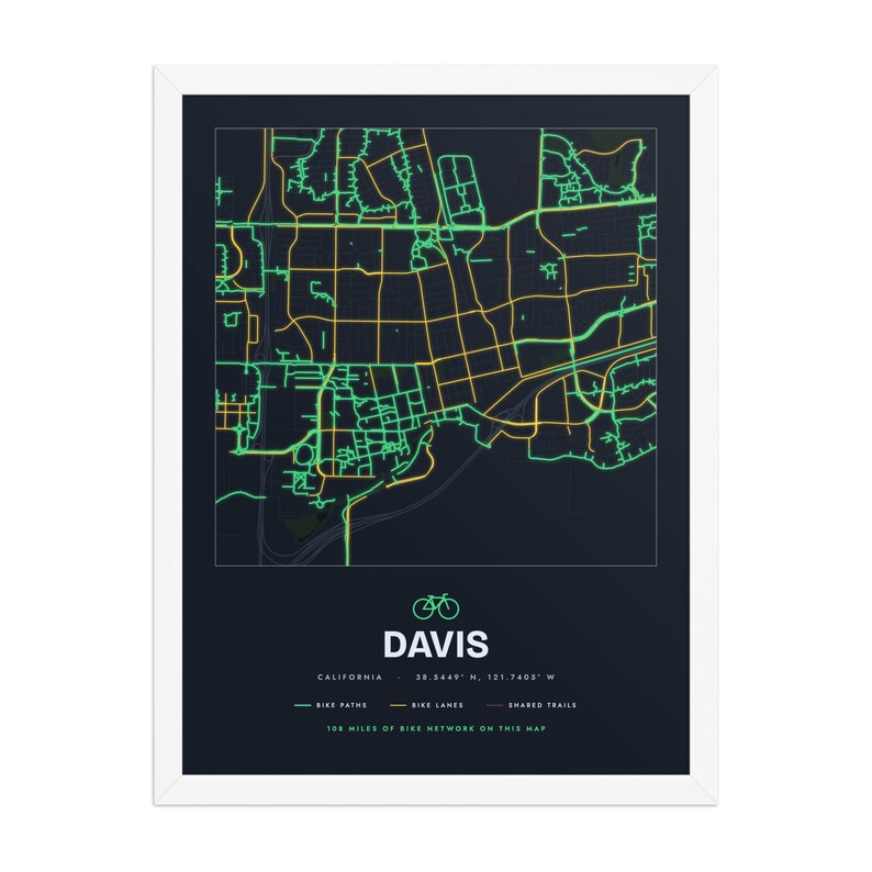 Real product photo: the Custom Bike Map Print in the white wood frame with a clear acrylic front