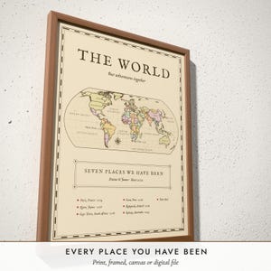 Three-quarter view of the framed Antique World Map poster on a white plaster wall
