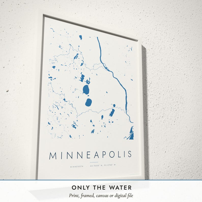 Three-quarter view of the framed Water Lines Map poster on a white plaster wall