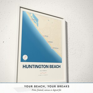 Three-quarter view of the framed Surf Break Map poster on a white plaster wall