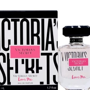 Victoria&#39;s Secret Love Me Perfume with Pink Accents.
