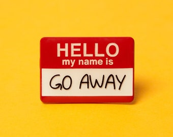 May include: A red and white name tag with the words "HELLO my name is GO AWAY" in black and white. The name tag is rectangular and set against a yellow background.