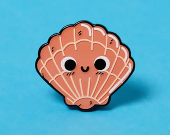 May include: A pink and white enamel pin shaped like a seashell with a smiling face.