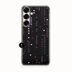 May include: A black phone case featuring a pattern of pink, blue, and purple squares. The case has a clear border and a camera module with three lenses. The design is a digital or tech-inspired pattern.
