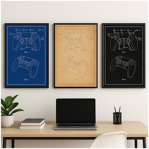 May include: Three framed prints showcasing a video game controller blueprint design. The prints are in blue, tan, and black, each with a black frame. The controller diagrams are detailed, showing the buttons and layout. The prints are displayed above a desk with a laptop.