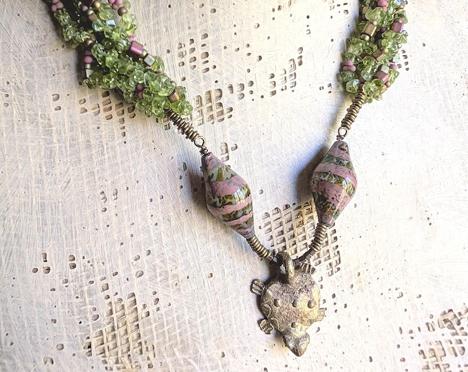 WhoShowsHisHeadNot: African brass gold weight talisman with multiple strands of peridot and artisan bicones