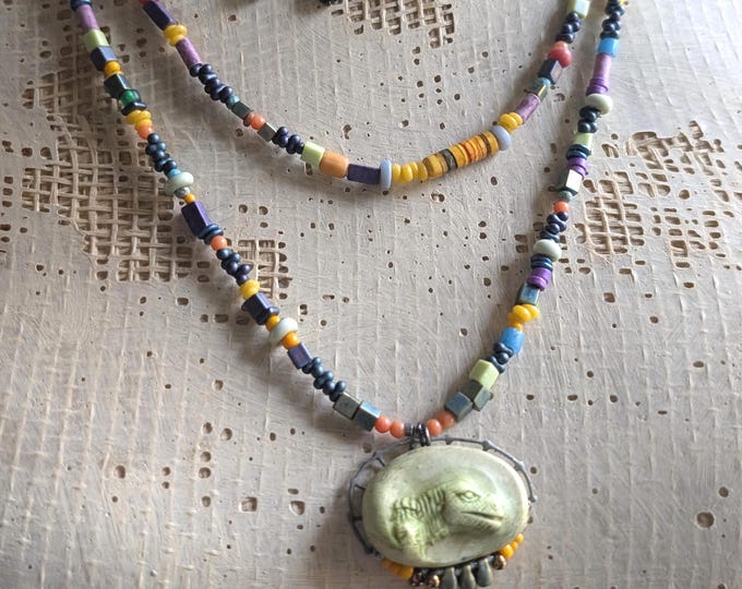 Three strand set: "Jon says Velociraptor" with artisan pendant and colorful seed beads