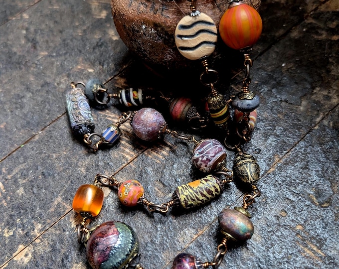 Unique artisan Storyteller strand - "Stria" - all-different handmade and artisan beads on a long necklace