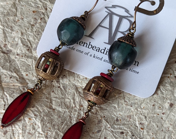 CAGEY: Teal Lampwork and African cast brass dangle earrings by alienBeadings