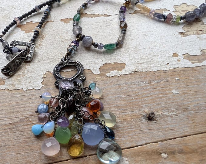 Cornucopia of gems: Luxe dancing gemstone focal on a strand of multicolored stones