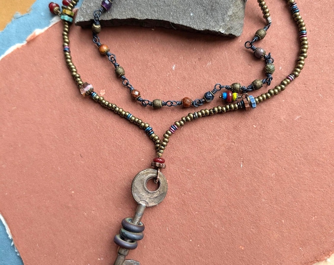 Magic Key: Long artisan flamework pendant strand  - warm neutrals with onyx, carnelian, Czech dangles