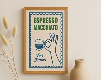 Può includere: Una stampa incorniciata con le parole "Espresso Macchiato" in verde e un bordo blu. L'immagine presenta una mano che fa il gesto "ok", tenendo una tazza di caffè. Le parole "Por Favor" sono sotto.