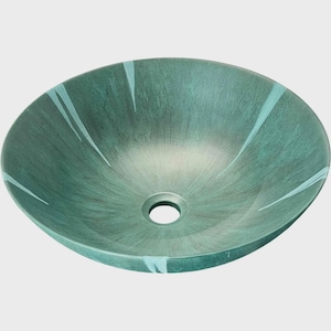 May include: An oval-shaped bathroom sink in teal with a textured finish. Light blue streaks radiate from the centre. The sink has a drain hole. The sink's dimensions are approximately 40 cm in diameter.