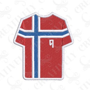 May include: An embroidered patch shaped like a t-shirt featuring the red, white, and blue flag of Iceland. The design includes a blue cross with white borders on a red background, with a small white number nine printed on the front chest area.