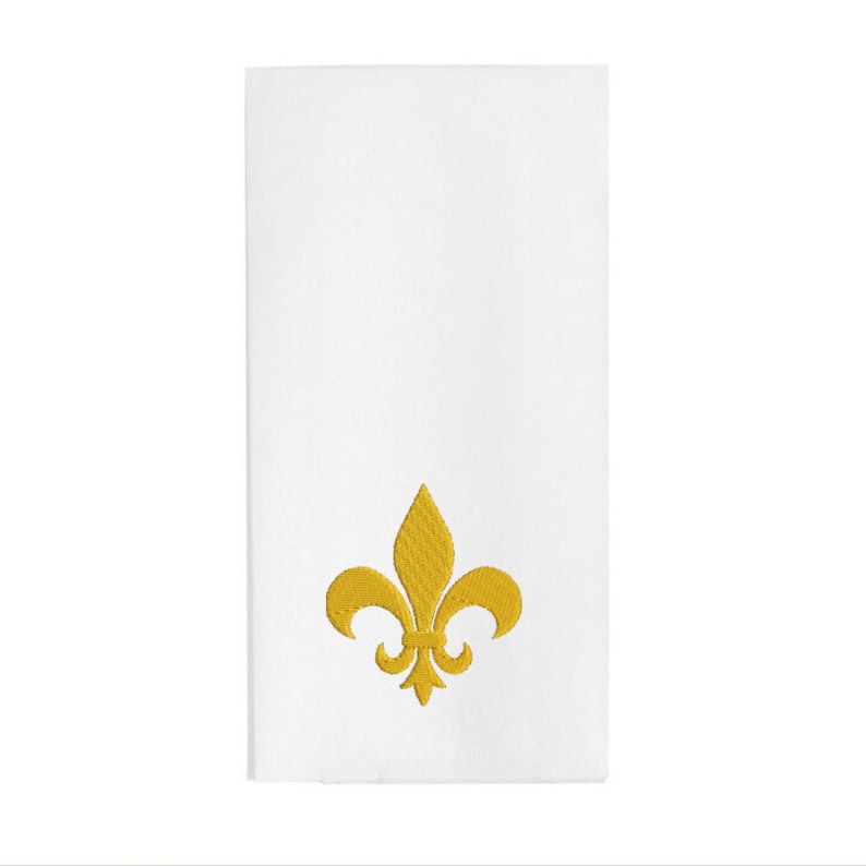 May include: White hand towel with a gold embroidered fleur-de-lis design.