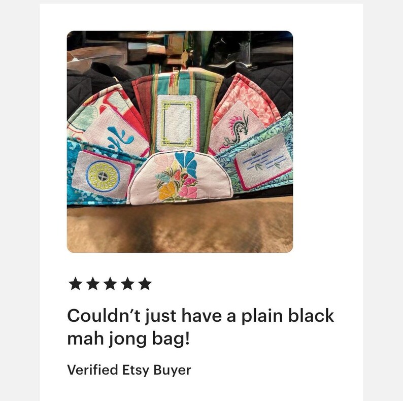 May include: A collection of colorful mah jongg tile bags, each with unique embroidered designs. The bags feature various patterns, including floral, geometric, and Asian-inspired motifs. The text "Couldn't just have a plain black mah jong bag!" is visible.
