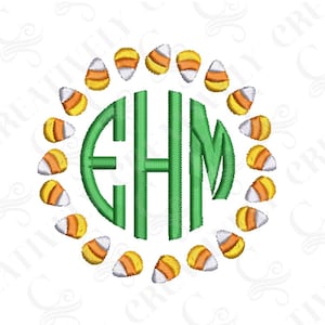 May include: Green monogram letters "EHM" surrounded by a circle of orange and white candy corn.