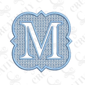 May include: A light blue monogram letter M with a decorative, scalloped border and a patterned design inside.