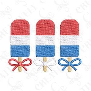 May include: Three embroidered popsicles in red, white, and blue, each with a bow at the base. The popsicles are on wooden sticks, and the bows are red, white, and blue. The design is a patriotic theme.