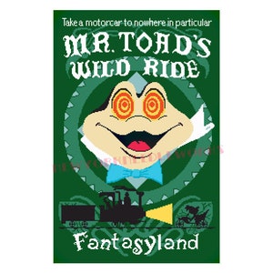 May include: A green poster with a cartoon frog with red eyes and a bow tie. The poster says "Mr. Toad's Wild Ride" and "Fantasyland".