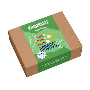 May include: A brown cardboard box with a green label that reads "KINDERARTZ Glue It 2.0". The label features colorful abstract shapes and the age range "9-12 Years old". The email address mykinderartz@gmail.com and website mykinderartz.com are also printed on the label.