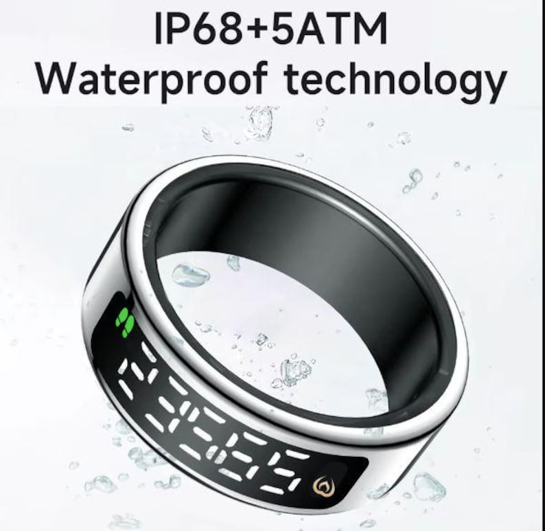 May include: A silver-toned smart ring with a black inner band and a digital display showing white segmented numbers. The text IP68+5ATM Waterproof technology is visible above the ring, which is surrounded by floating water droplets.
