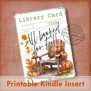 May include: A rectangular Kindle insert featuring a library card design with the text "All booked for Fall". The illustration includes a wooden chair, an open book, a plaid blanket, pumpkins, and autumn leaves in shades of orange and yellow.