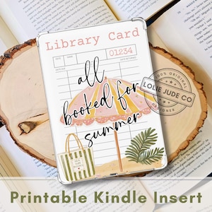 May include: A rectangular Kindle insert featuring a vintage library card design with the text Library Card, 01234, and the phrase all booked for summer. The graphic includes a pink and yellow beach umbrella, a green striped tote bag, and a palm leaf.