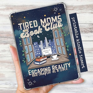 May include: A navy blue Kindle case with the text "TIRED MOMS Book Club" and "ESCAPING REALITY one chapter at a time." The design includes a window scene with a cityscape, books, and a coffee cup. A printable kindle insert is included.