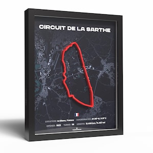 May include: Framed artwork of the Circuit de la Sarthe race track in Le Mans, France. The track is outlined in red against a dark grey map. Text includes the track name, location, coordinates, and length of 13.626 km.