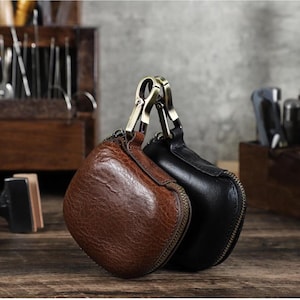 Funda protectora de cuero genuino para auriculares Bluetooth Powerbeats Pro 2, con hebilla colgante anticaídas y bolsa portátil para auriculares.