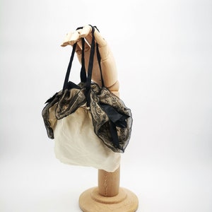 Antique French drawsting bag / purse in pale beige silk with net lace & black silk chiffon, black silk ribbon bows ornaments, flappers' era