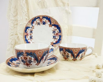 Ensemble antique de tasse à thé et soucoupe en pierre de fer, France, décor floral par transfert, Sarreguemines et Digoin