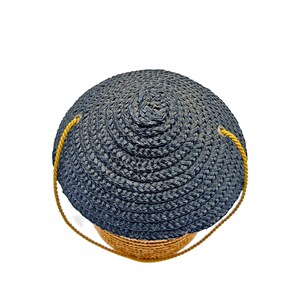 Top view of black woven straw conical hat lid