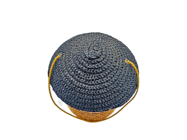 Top view of black woven straw conical hat lid