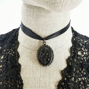 Antique French oval locket, opening medallion pendant, mourning locket / medallion in gutta percha with raised apples design, Victorian era