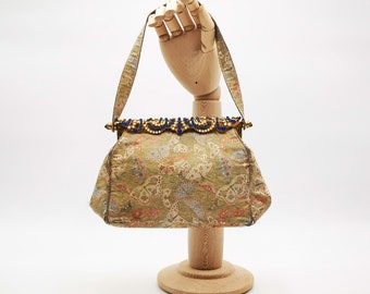 Vintage Italian evening purse, signed Amedeo, Turin, in gold lamè fabric with butterflies motif, jeweled closure