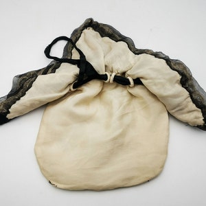 Antique French drawsting bag / purse in pale beige silk with net lace & black silk chiffon, black silk ribbon bows ornaments, flappers' era