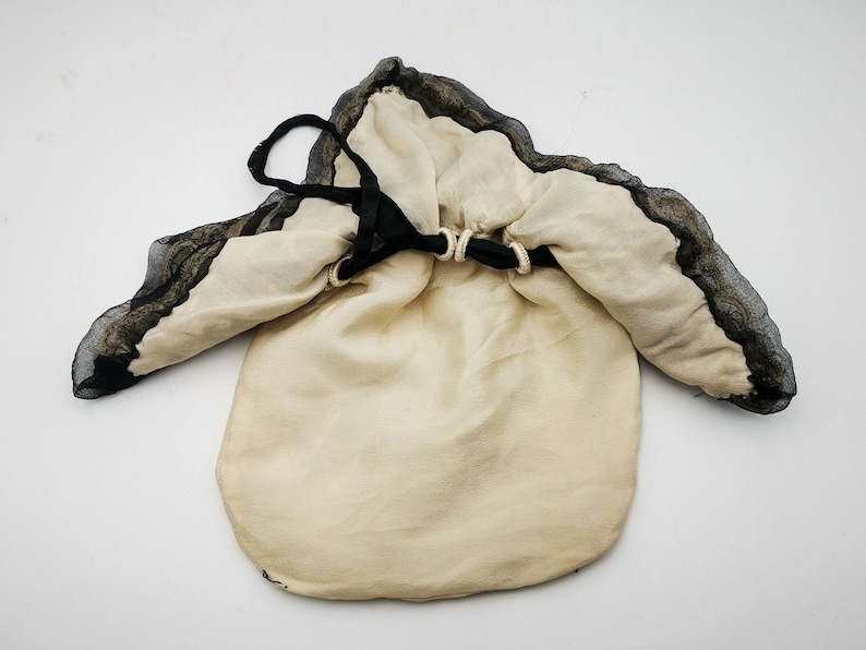 Antique French drawsting bag / purse in pale beige silk with net lace & black silk chiffon, black silk ribbon bows ornaments, flappers' era
