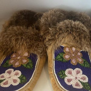 These are hand-beaded Indigenous moccasins - very beautiful from an estate.