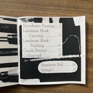 May include: A black and white image of a page from a book listing different printmaking techniques and their corresponding page numbers. The techniques listed are Styrofoam Printing, Linoleum Block, Carving, Linoleum Block Printing, Quick Stamps, Collagraph, Rainbow Roll, and Intaglio.