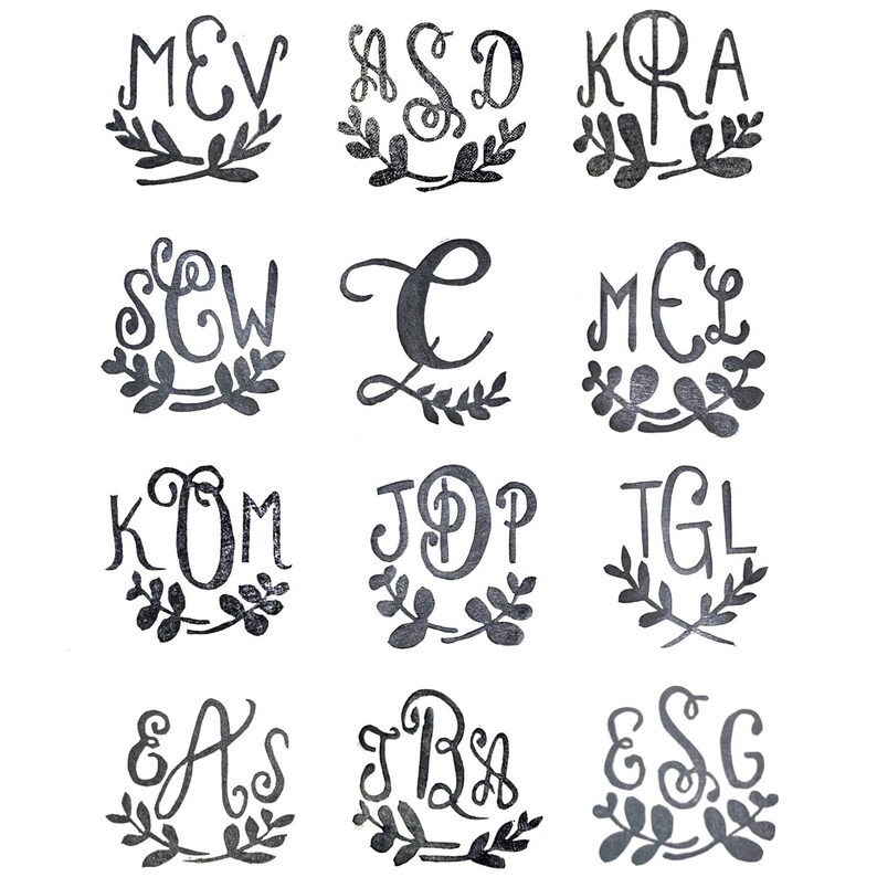 May include: Twelve black and white monogrammed designs with floral accents. Each design features a three-letter monogram with a stylized font and a simple floral wreath.
