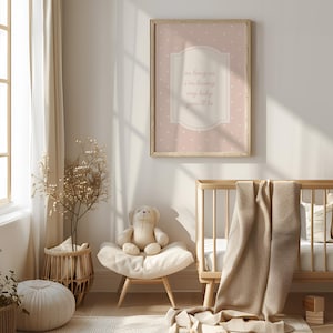 A cozy nursery with a wooden crib, a stuffed animal, and a framed wall art with a message. The room has a warm, inviting atmosphere with natural light coming in from a window.