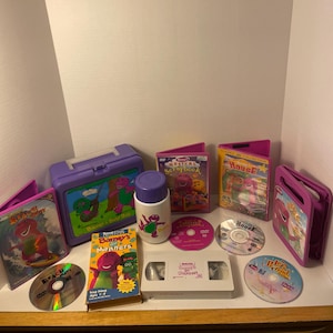 Vintage-Lot of 7 Barney Collectors set-Includes a 1992 lunch box, Thermos, 4 DVD’s(see description for list), & Barney’s Best Manners VHS